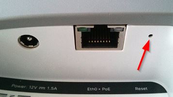 Reset button of the MR11, MR14, MR18, MR26, MR32, MR33, and MR34 is located next to the Ethernet port. 