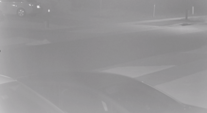 The image shows a washed out night mode view due to infrared light reflection