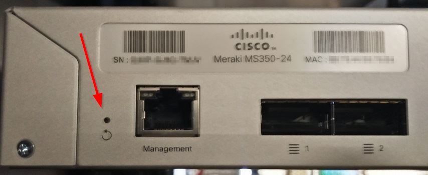Circular arrow reset button on MS350 switch - located on the back-left panel near the management port